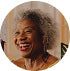 Round badge with a portrait of a person on a white background