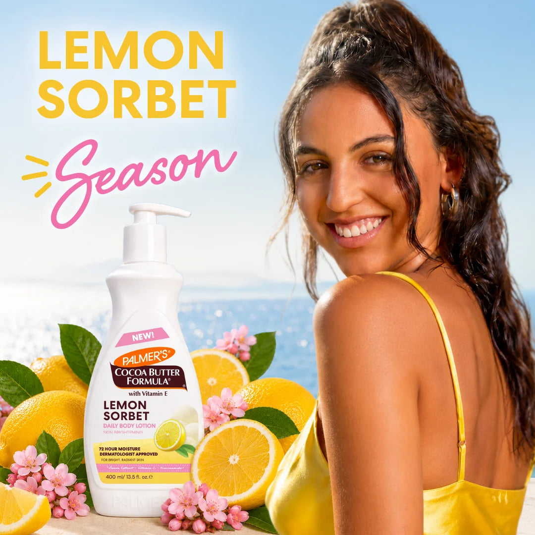 A bottle of Palmer's Cocoa Butter Formula Lemon Sorbet Body Lotion is shown next to a smiling woman in a yellow top, with lemons, pink flowers, and a beach background. Large text reads 'LEMON SORBET Season'.