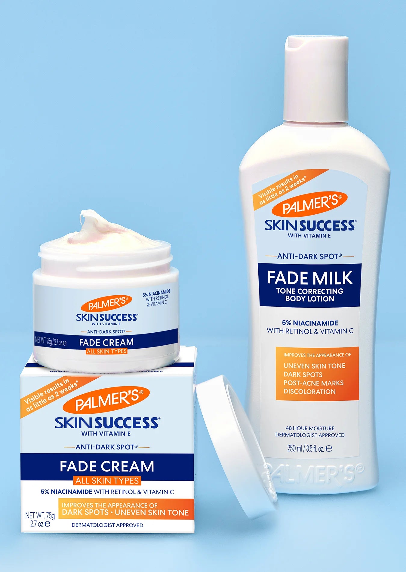 Palmer's Skin Success fade cream and milk on a blue background